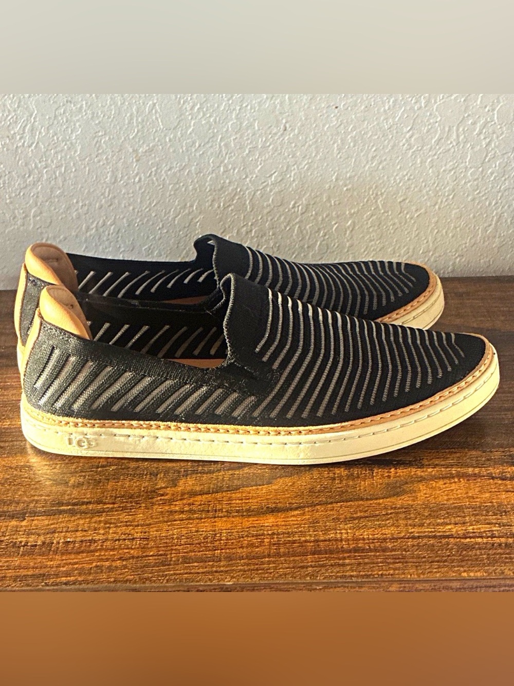 UGG Black Knit Slip-On Loafers with Cream Sole and Tan Heel Accent